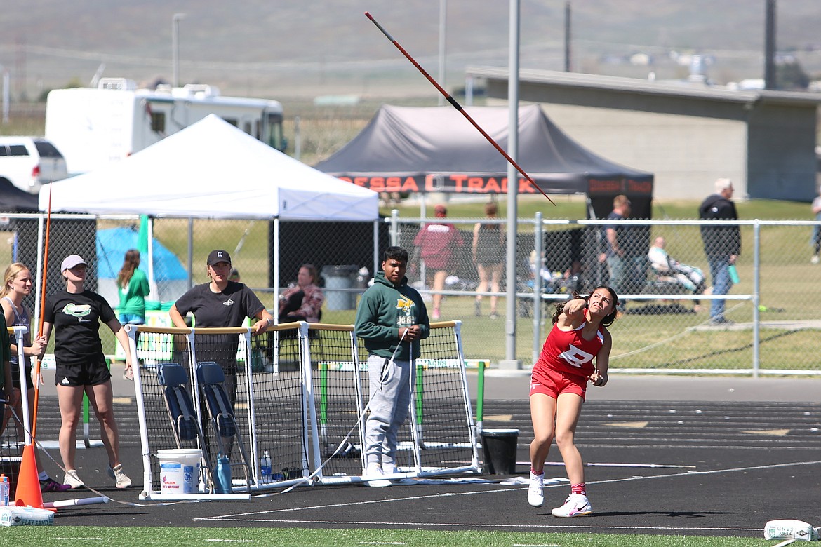 Brewster freshman Pepper Boesel, in red, heaves the javelin during her winning throw at Saturday’s CLA Quincy Invitational, recording a distance of 126 feet, 8 inches.