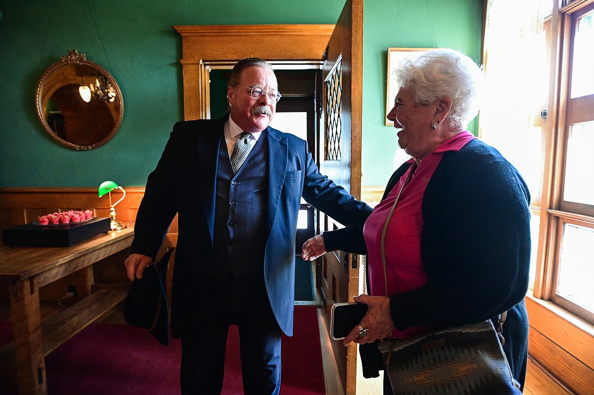 Impersonator Joe Wiegand greets a guest as he portrays 26th U.S. President Theodore Roosevelt during a tour of the Conrad Mansion in Kalispell on Wednesday, April 24. (Casey Kreider/Daily Inter Lake)