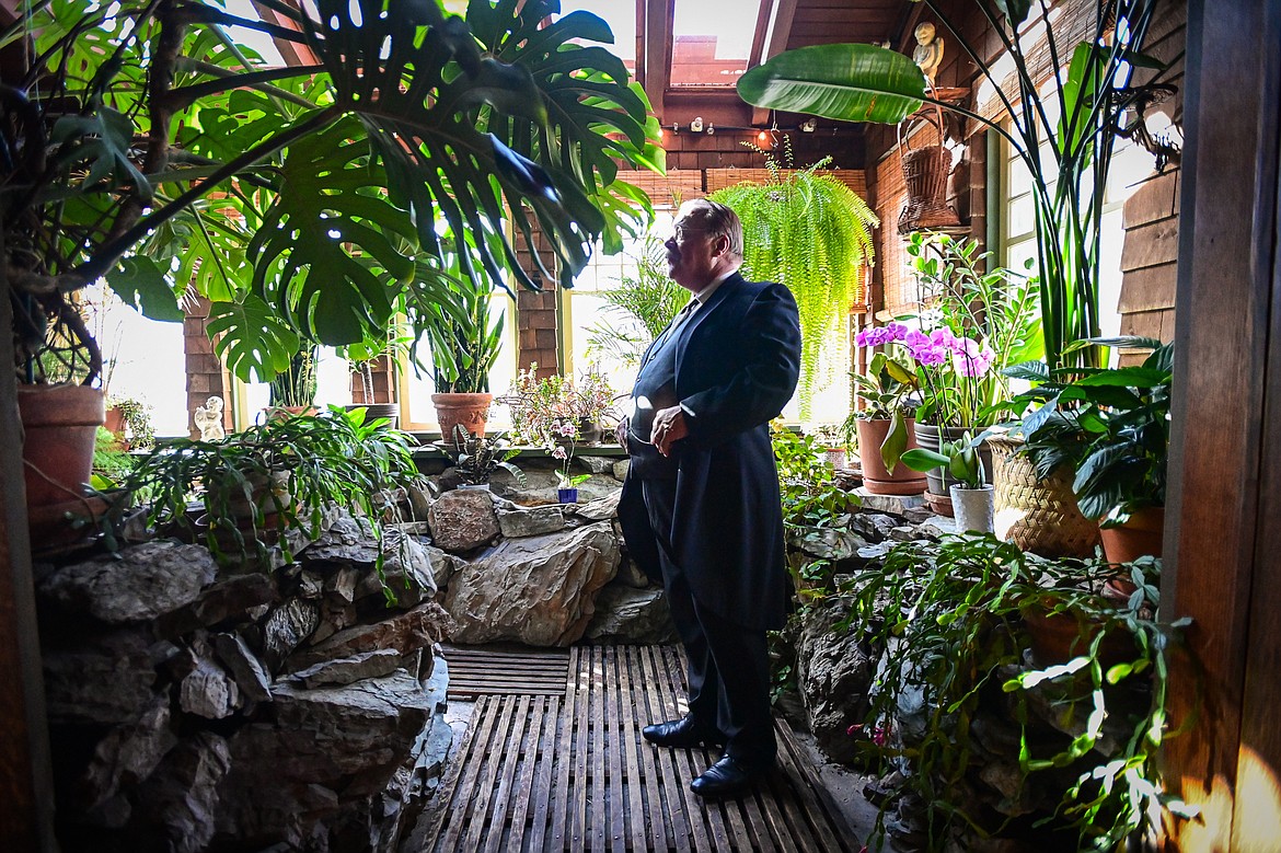Impersonator Joe Wiegand, portraying 26th U.S. President Theodore Roosevelt, stands in the Fernery during a tour of the Conrad Mansion in Kalispell on Wednesday, April 24. (Casey Kreider/Daily Inter Lake)