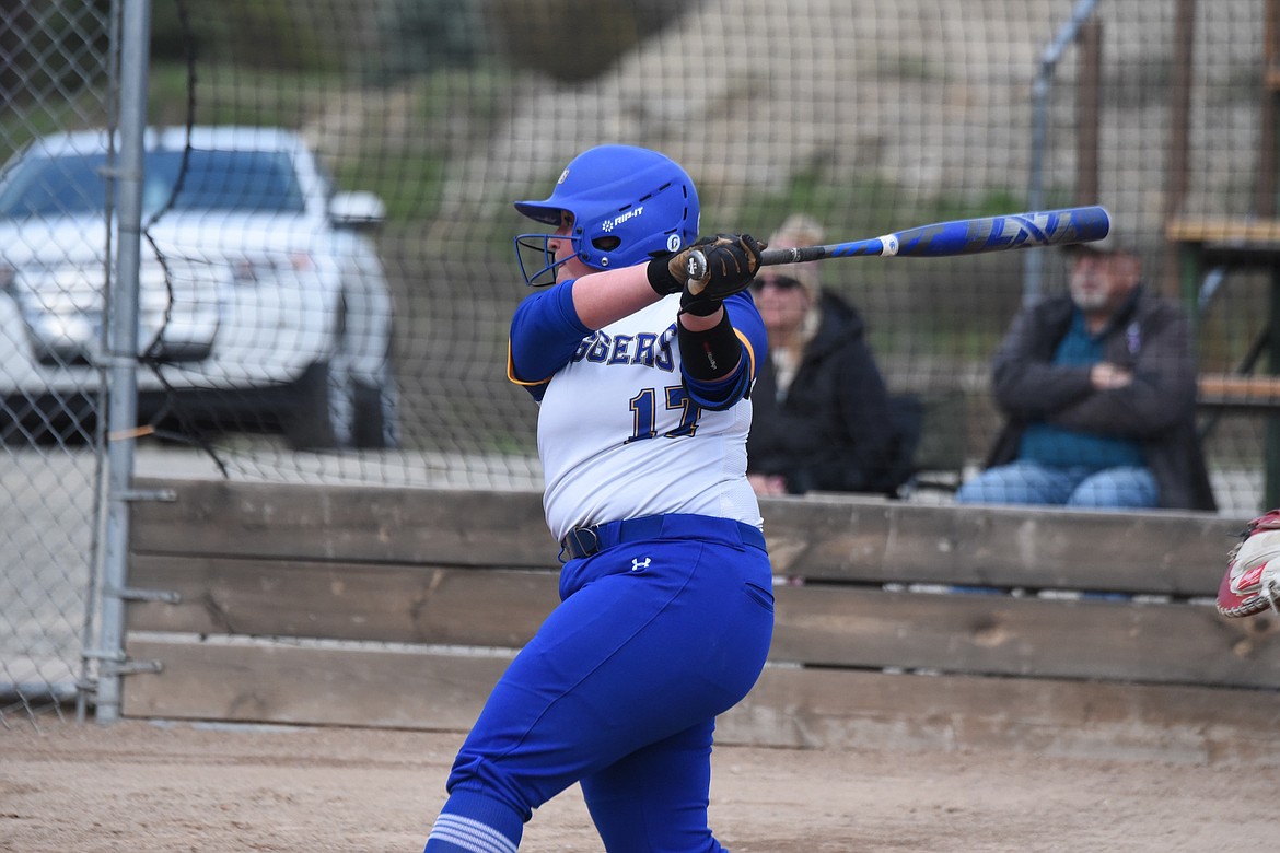 Libby softball player Aleesha Bradeen swings away on April 18 against Columbia Falls. (Scott Shindledecker/The Western News)