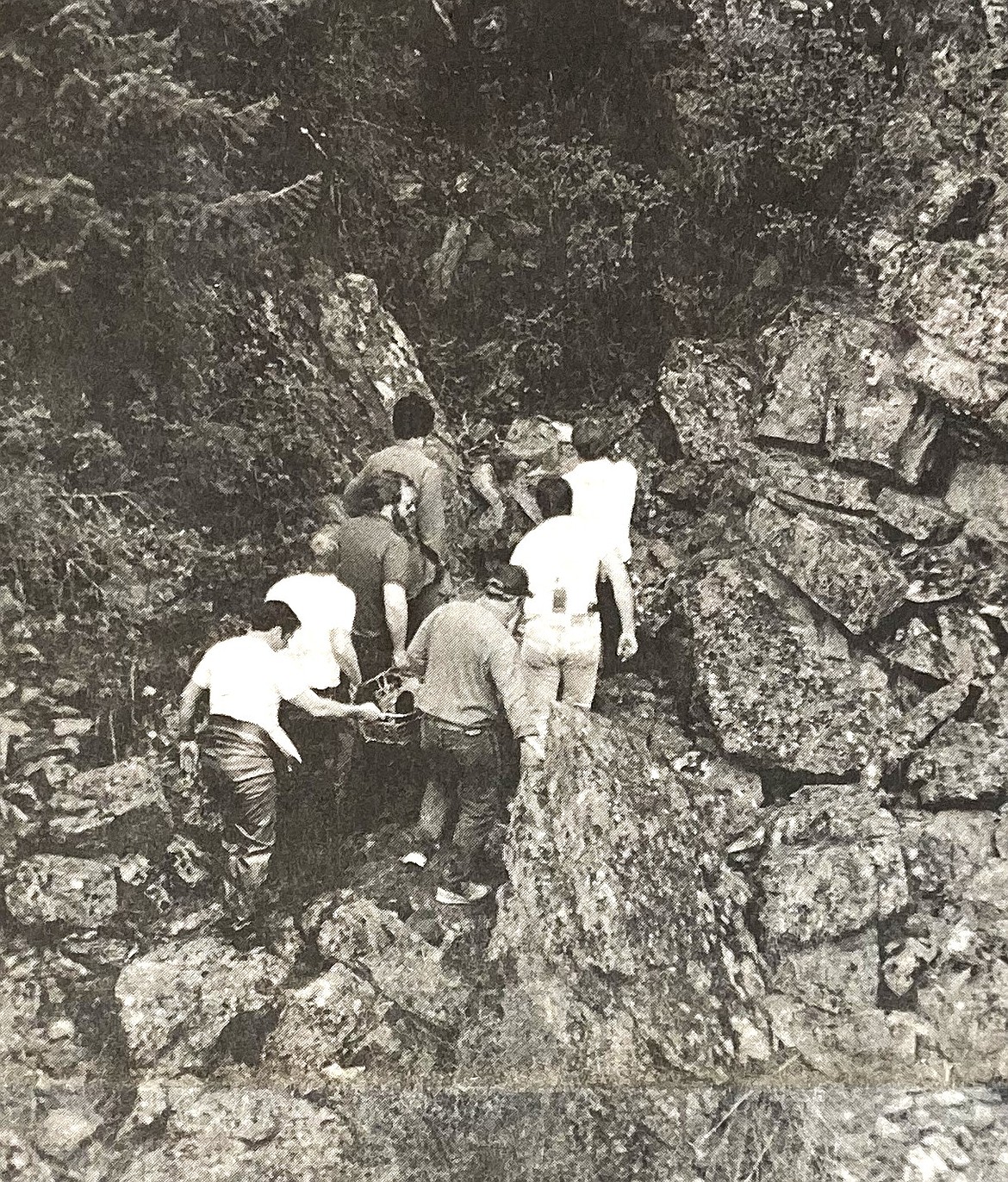 Emergency workers remove a victim who was swept through Post Falls dam.