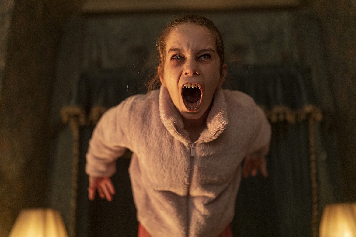 This image released by Universal Pictures shows Alisha Weir in a scene from the film "Abigail."