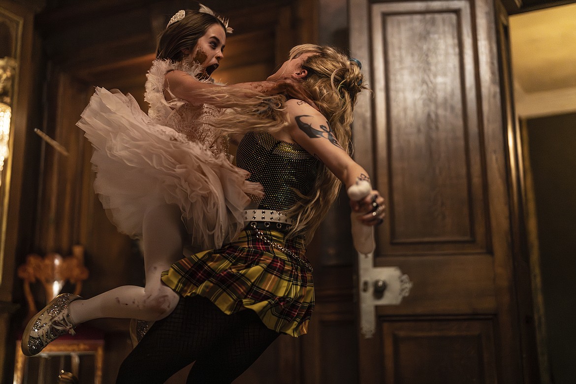 This image released by Universal Pictures shows Alisha Weir and Kathryn Newton in a scene from the film "Abigail."