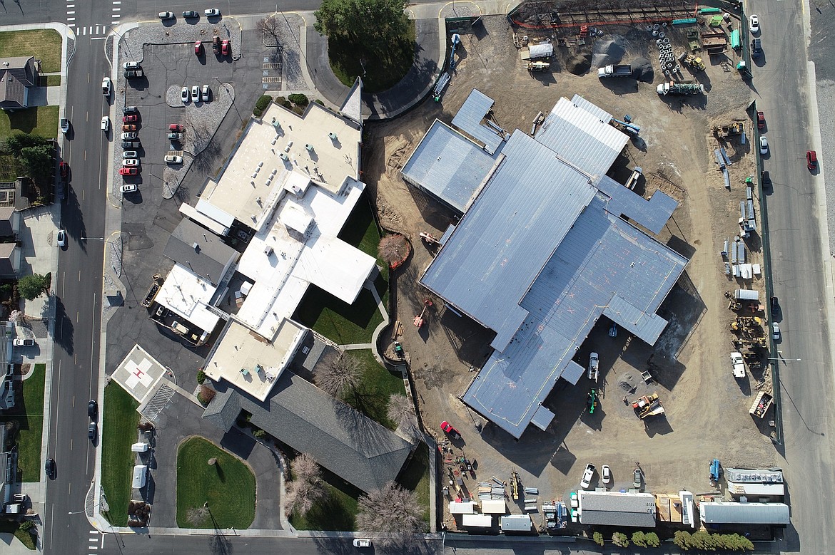 The new Quincy Valley Medical Center, right, is under construction next to the existing QVMC in this aerial photo.