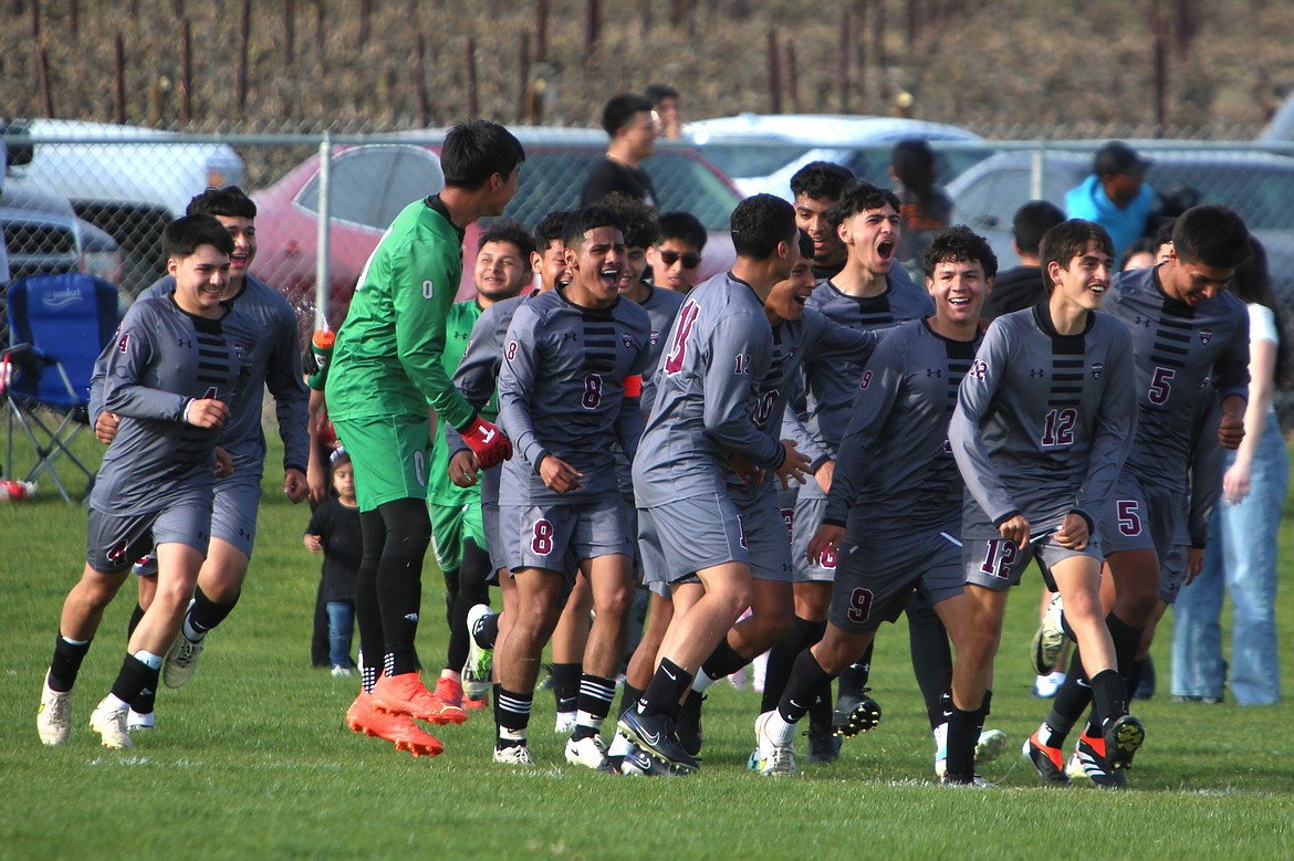 Wahluke boys soccer players celebrate after defeating Royal 1-0 on Tuesday in Mattawa.