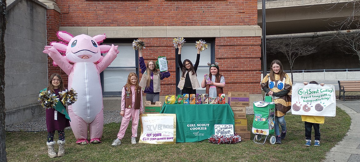 Though many of them had never been a Girl Scout or learned about sales practices before, Troop 2401 hit the ground running, using an inflatable axolotl costume as a point of interest for their cookie booth.
Left to right: Abigail Corona, Penny Pehan, Delia Pehan, Lyvia Finlay, Lucille Corona, Elliana Wurtz, and Riley Greer.