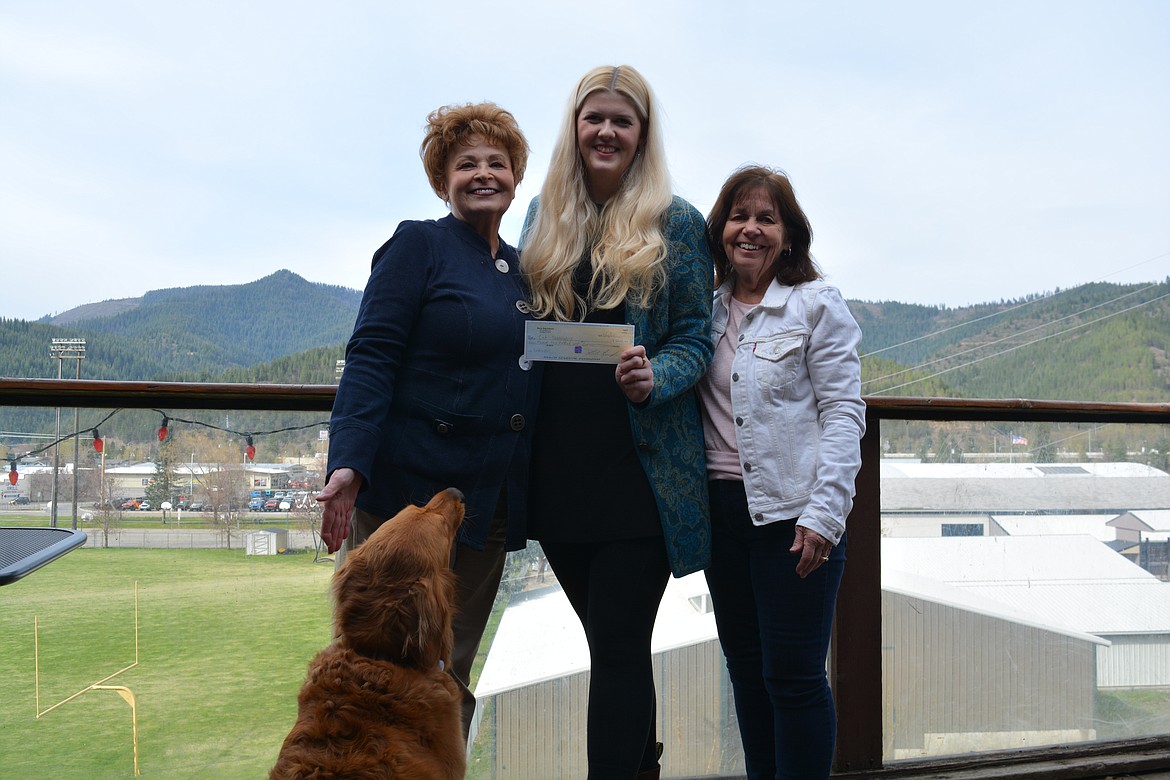 Autumn the dog, Juli Zook, Kyrsten Kennaugh and Rene Gilbert pose for a photo outside the Dirty Dog Saloon. 
Zook and Gilbert are part of the Cat Wranglers nonprofit to help stabilize the local cat population and the group recently held a fundraiser turning the bar into the "Dirty Kitty Saloon" for an evening. The check was presented by Kennaugh for $4,200.