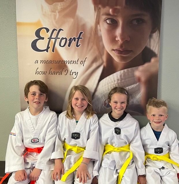 The Sandpoint Martial Arts Beginners Group. From left, Ryland DeBel (Orange Belt), Piper Maltby (Yellow Belt), Heidi Dyroff (Yellow Belt), and Clark Dyroff (Yellow Belt).
