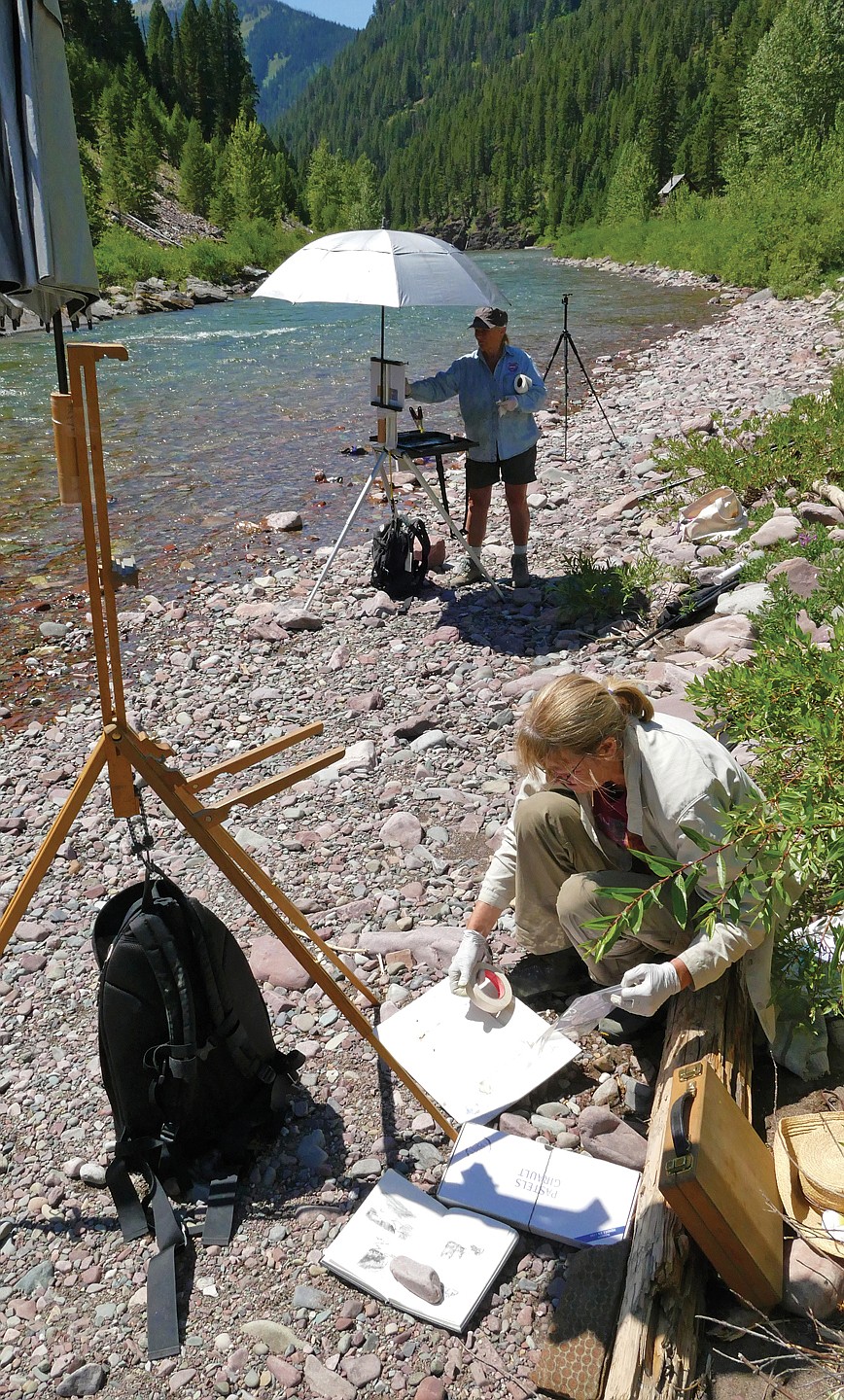 Residents Gini Ogle and Francesca Droll paint along the riverside. (Photo courtesy of Francesca Droll)