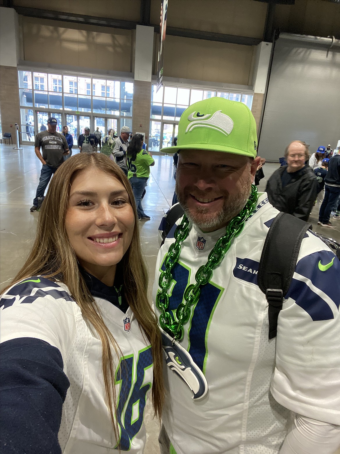 Paige Richardson snaps a selfie with her dad Bob Richardson at a Seahawks game.