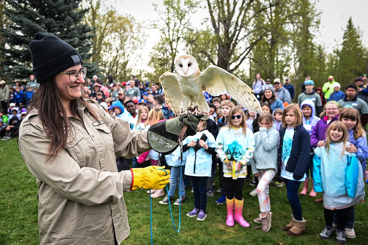 Dani Crandell with Montana Wild Wings Recovery Center holds a barn owl during a demonstration at the Arbor Day celebration at Lawrence Park on Friday, April 26. (Casey Kreider/Daily Inter Lake)