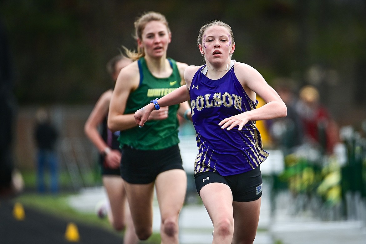 Polson's Morgan Delaney crosses the finish line in first in the girls 1600 meter run at the Whitefish ARM Invitational on Saturday, April 27. (Casey Kreider/Daily Inter Lake)