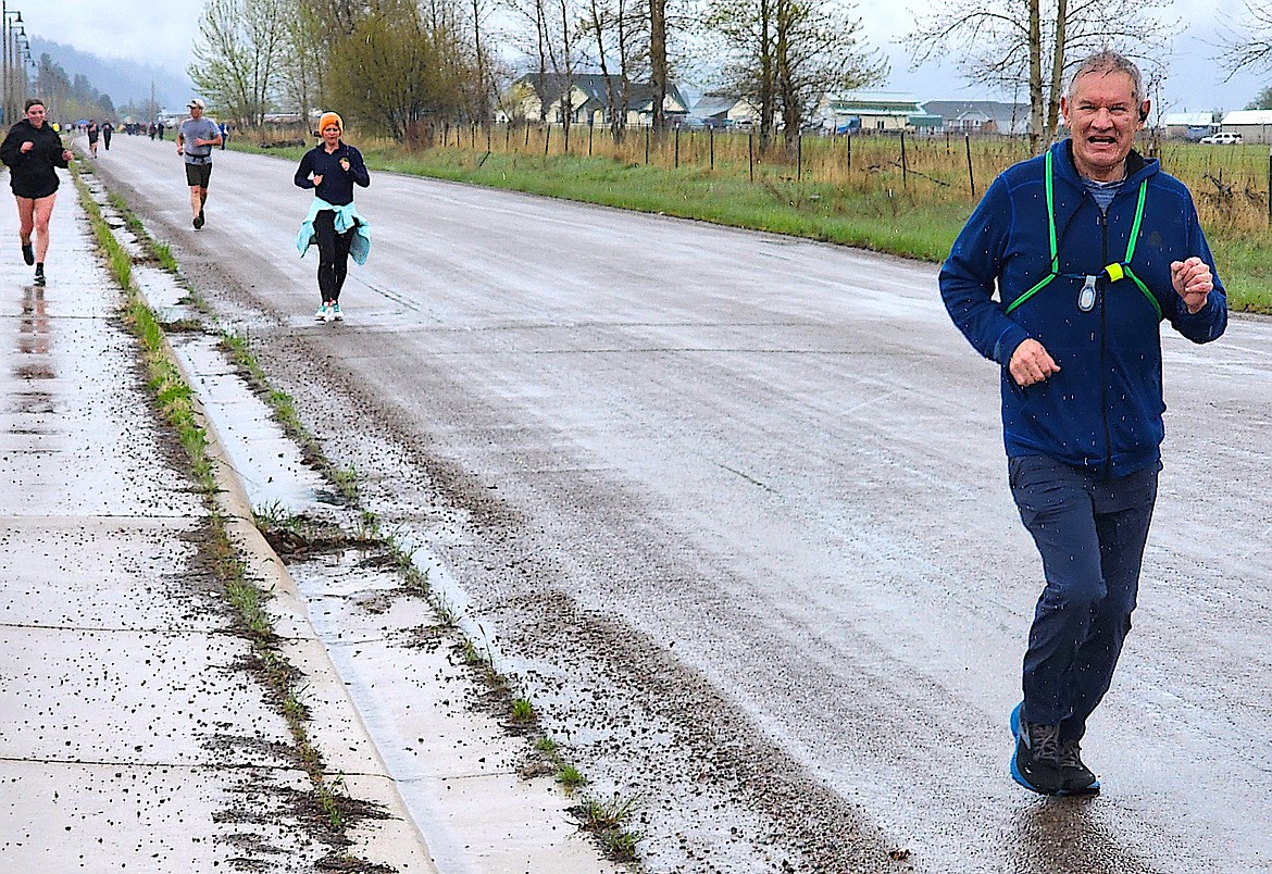 A little rain and grey skies didn't stope the runners in the Buttercup Run in Arlee. (Berl Tiskus/Leader)