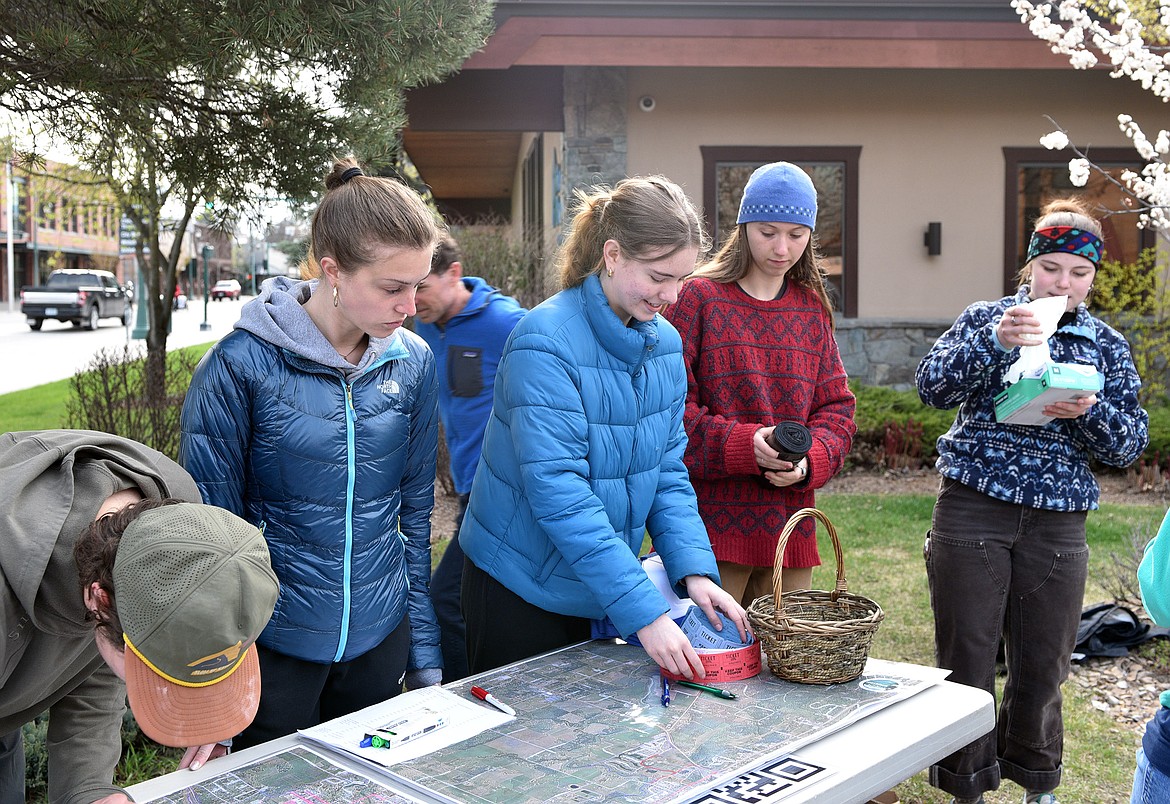 Volunteers help assign areas and distribute raffle tickets the morning of Clean the Fish (Kelsey Evans/Pilot).