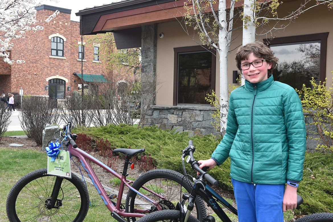 The winner of the 12-and-under bike raffle at Clean the Fish (Kelsey Evans/Pilot).