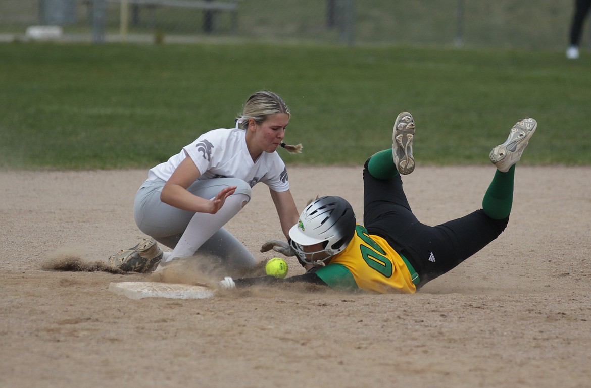 MARK NELKE/Press
Baylee Frank (00) of Lakeland slides safely into second base as the ball comes loose from Lake City shortstop Layla Gugino in the first game Saturday at Lake City High.