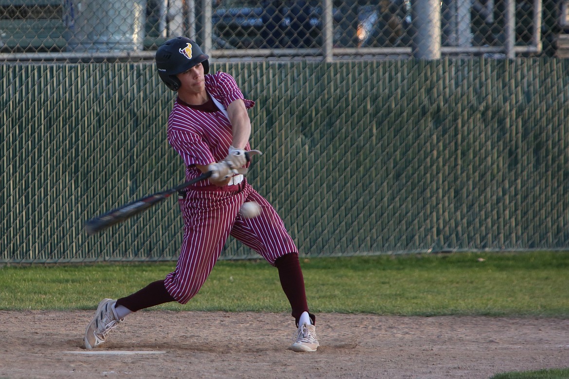 Moses Lake senior Jayce Stuart swings at the ball during an at-bat in Friday’s nightcap against Wenatchee. Stuart delivered the game-tying run in the bottom of the seventh to send the game to extra innings.