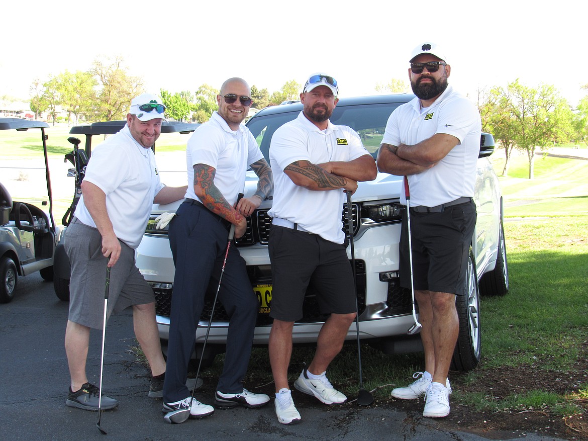 Golfers ham it up for the camera during last year's Moses Lake Chamber of Commerce golf tournament.