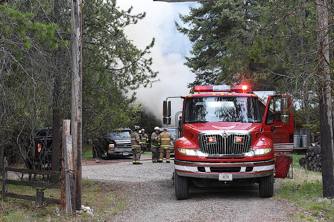 Heavy smoke pours off a fire that destroyed a small home Sunday afternoon south of Libby. A county resident died in the fire. (Scott Shindledecker/The Western News)