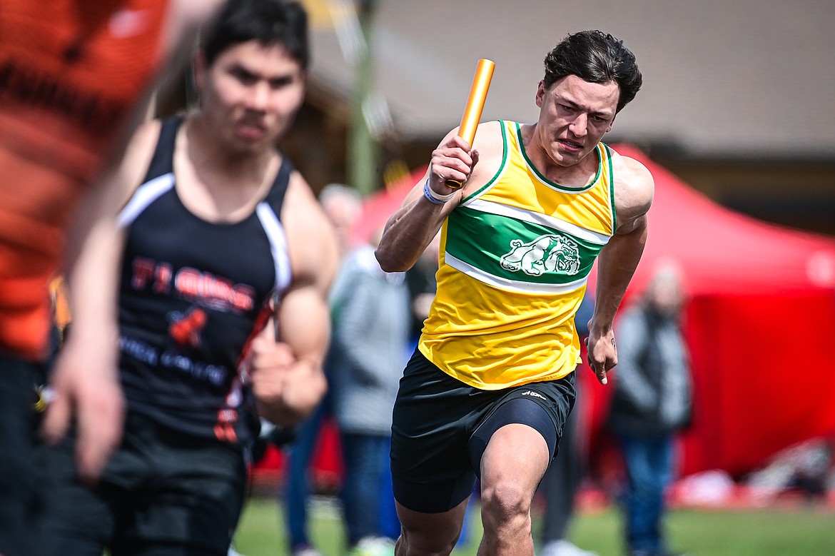 Whitefish's Ryder Barinowski runs the first leg of the boys 4x100 relay at the Whitefish ARM Invitational on Saturday, April 27. (Casey Kreider/Daily Inter Lake)