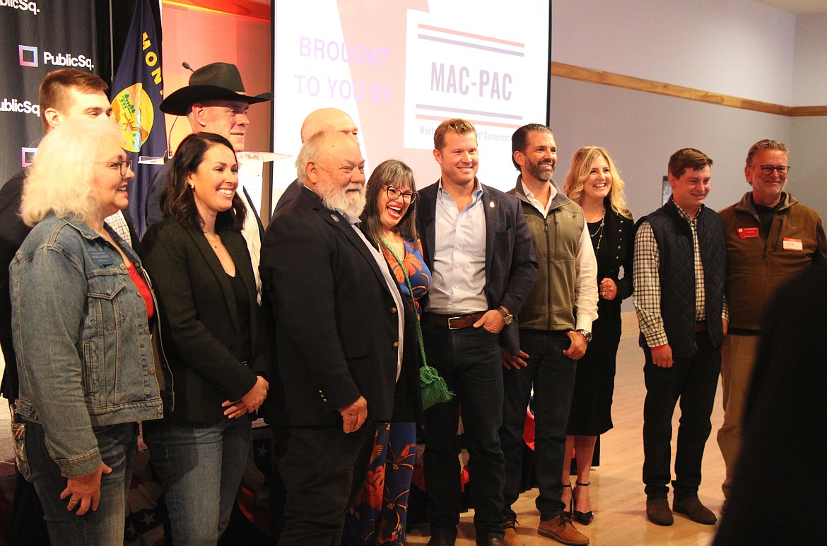 Donald Trump Jr., fourth from right, poses with U.S. Senate candidate Tim Sheehy, Gov. Greg Gianforte, U.S. Rep. Ryan Zinke and other supporters at a Missoula fundraiser on April 28, 2024. (Mara Silvers/MTFP)