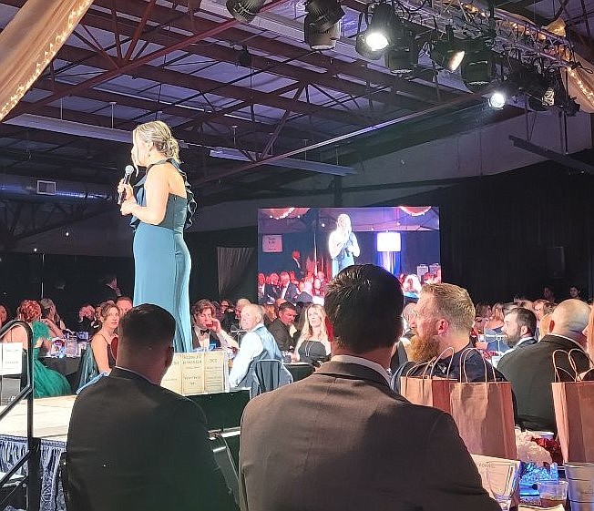 Gretchen Youngren, chief development and communications officer for Samaritan Hospital, speaks to attendees during Friday's Bourbon & Bowties event. Youngren and several others brought the community together to raise money for the hospital.