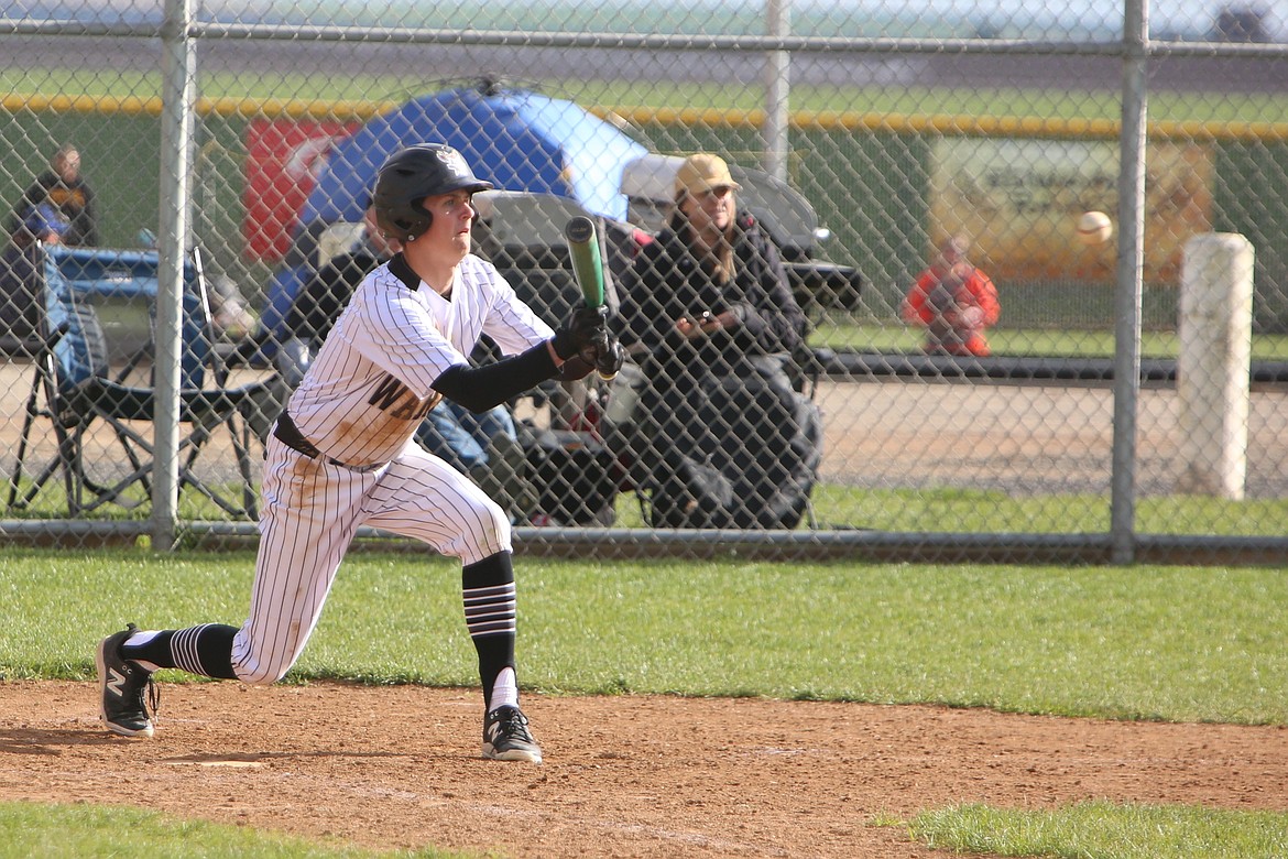 Almira/Coulee-Hartline sophomore Brady Roberts prepares to lay down a bunt in the nightcap of the Warriors’ doubleheader against Republic on Saturday.