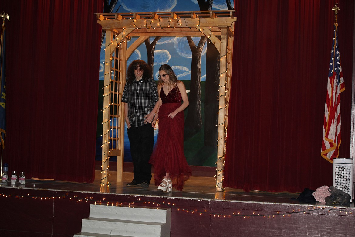 The arch on stage framed prom goers during their introduction.