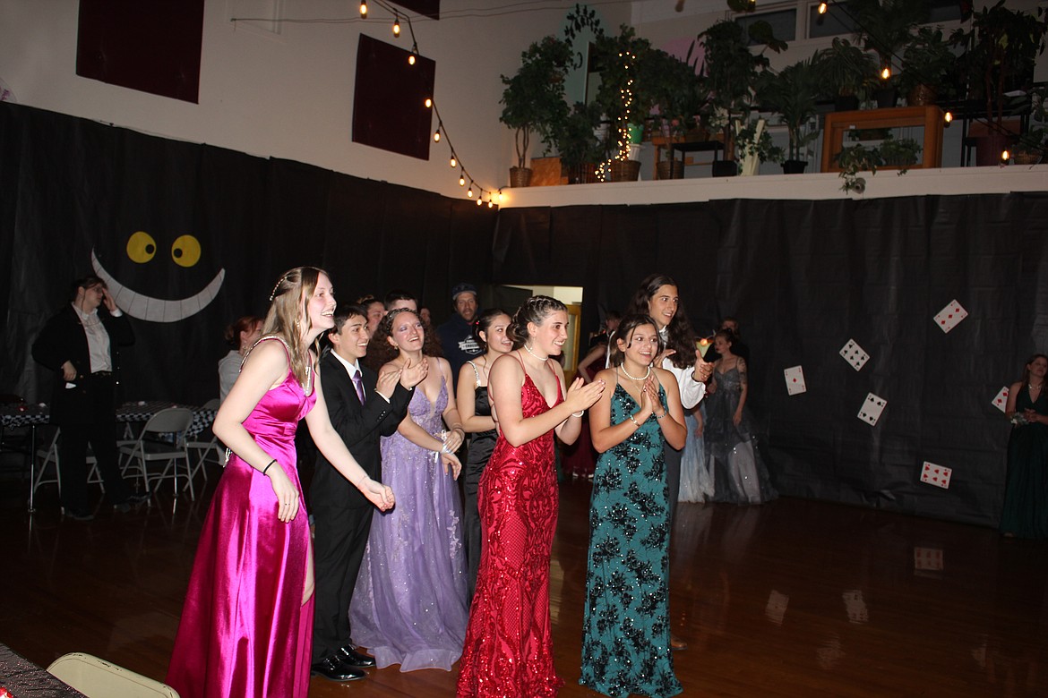 Students cheer for the Alberton prom royalty and their peers on stage.