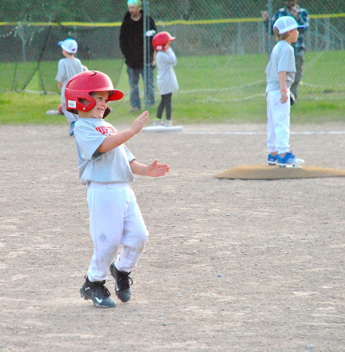 Sometimes doing the robot helps you make it to second base. Henry Crabb on the Blue Team for Superior's T-Ball throws in the some style Thursday night at Timberman Park. (Mineral Independent/Amy Quinlivan)