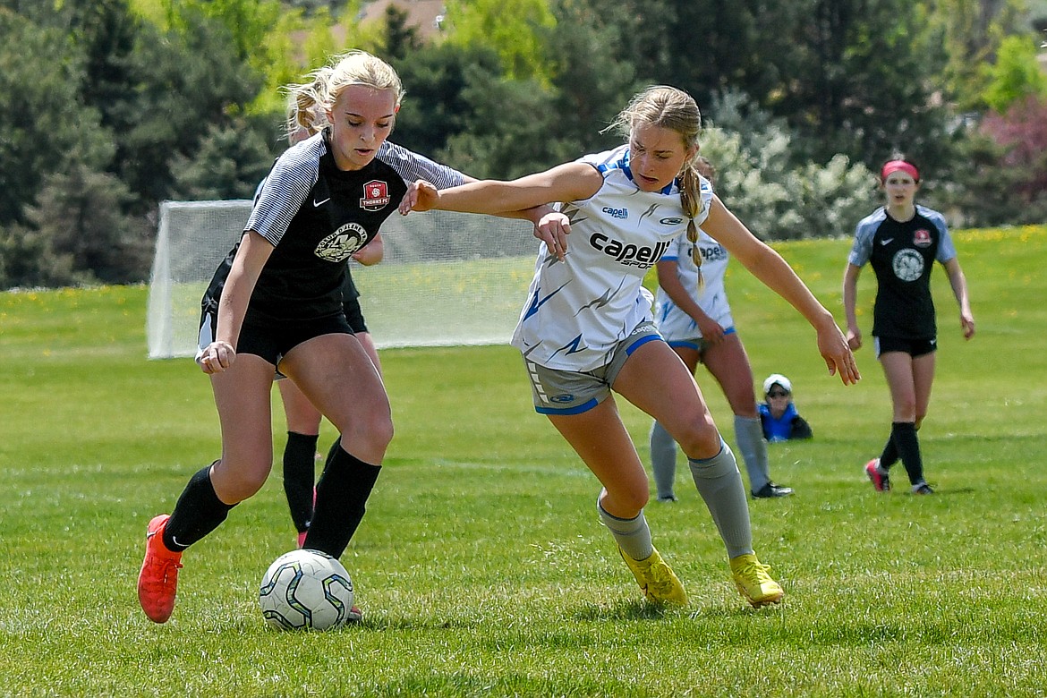 Photo by LARISSA KERLEY
Katie Kovatch, left, of the Thorns North FC 2009 girls soccer team scored the game-winning goal off a free kick in the championship of the Idaho State Cup last weekend in Boise.