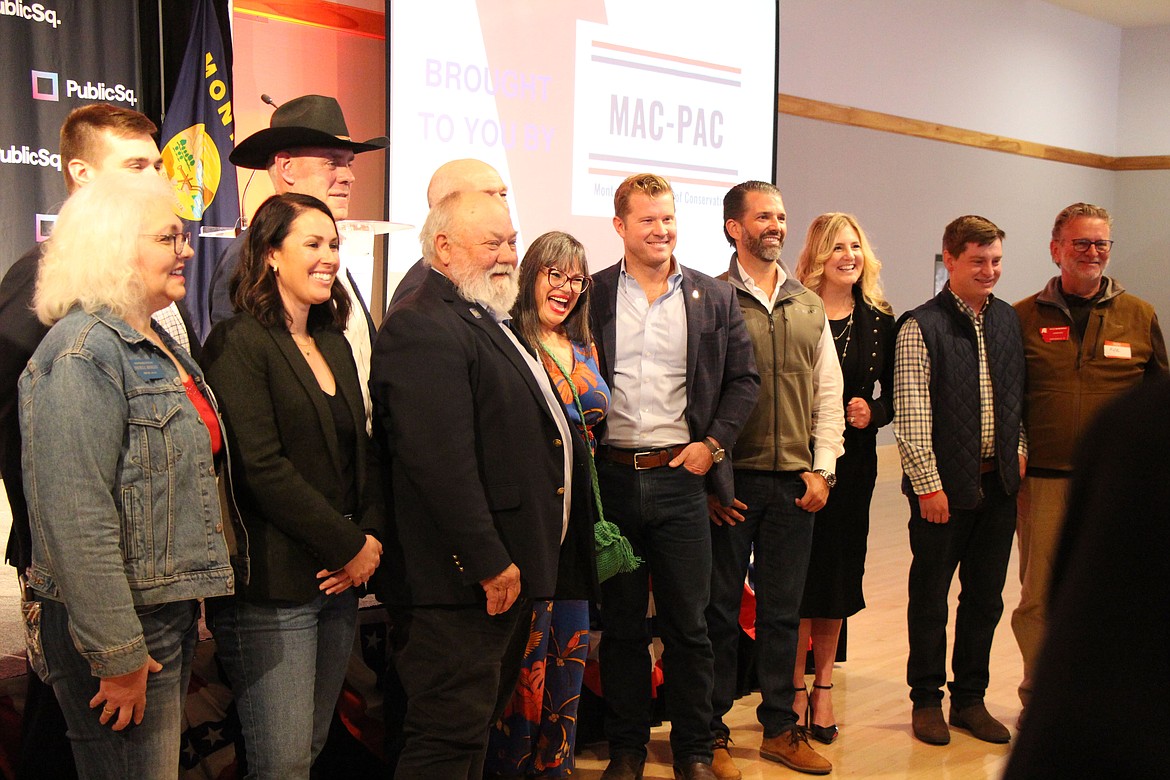 Donald Trump Jr., fourth from right, poses with U.S. Senate candidate Tim Sheehy, Gov. Greg Gianforte, U.S. Representative Ryan Zinke and other supporters at a Missoula fundraiser on April 28, 2024. Credit: Mara Silvers / MTFP