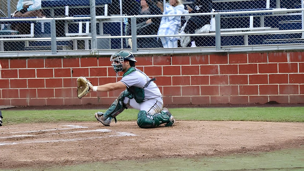 Big Bend catcher Ben Belich stays ready behind the plate to catch a pitch during a Big Bend baseball game.