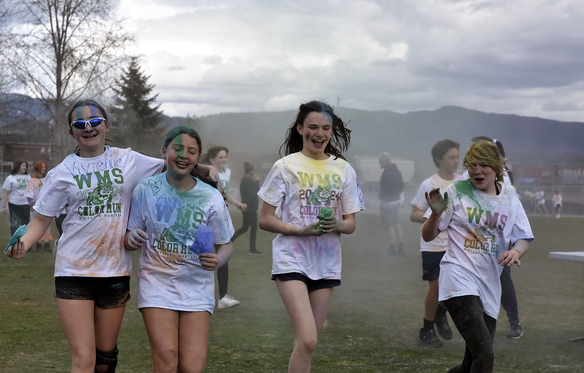 Sixth graders (left to right) Anna Brooke Mckay, Lola Avalos, Ruby Richards and Lilliana Bowden-Smith participate in the color run (Kelsey Evans/Pilot).