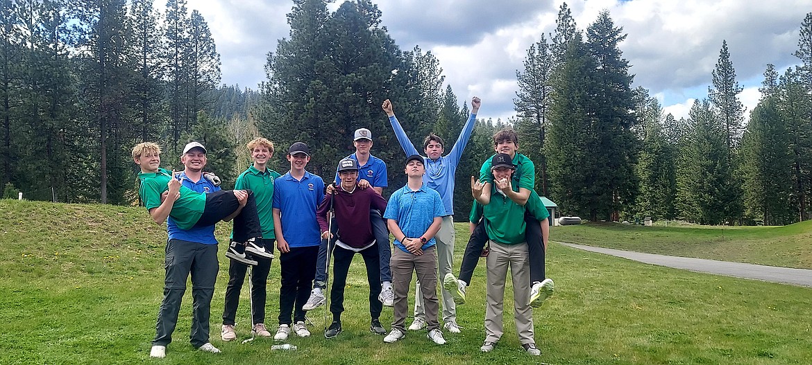 Golfers from St. Regis and Superior celebrate after the St. Regis Invitational tournament this past Thursday in St. Regis, won by St. Regis green shirts. The Tigers' individual champion, Jack Connolloy (light blue shirt, back row) shot a 79 for St. Regis. (Photo by Emily Park)