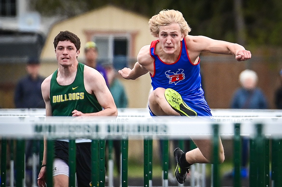 Bigfork's Wyatt Johnson clears a hurdle in the boys 110 meter hurdles at the Whitefish ARM Invitational on Saturday, April 27. (Casey Kreider/Daily Inter Lake)