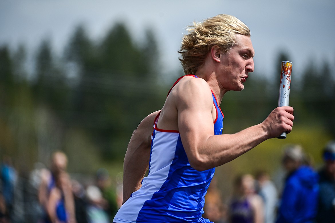 Bigfork's Wyatt Johnson runs the first leg of the boys 4x100 relay at the Whitefish ARM Invitational on Saturday, April 27. (Casey Kreider/Daily Inter Lake)