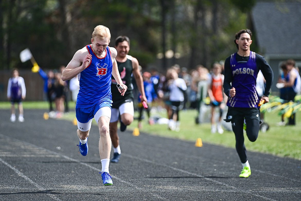 Bigfork's Robert Merchant runs the anchor leg of the boys 4x100 relay at the Whitefish ARM Invitational on Saturday, April 27. (Casey Kreider/Daily Inter Lake)