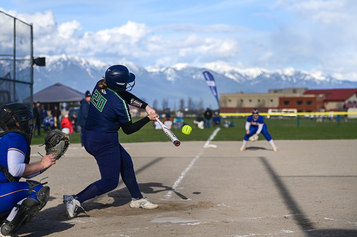 Glacier's Aubree Gerber (20) knocks in a run with an RBI single in the fifth inning against Missoula Big Sky at Glacier High School on Tuesday, April 30. (Casey Kreider/Daily Inter Lake)