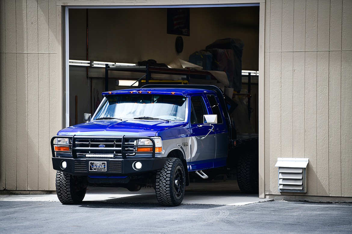 Tanner Lair's refurbished Ford F-250 is driven out of a garage bay at Glacier Collision Worx in Evergreen on Tuesday, April 30. The Make-A-Wish foundation provided $10,000 in funding to revamp the truck for Lair, who is in remission from non-Hodgkin lymphoma. (Casey Kreider/Daily Inter Lake)