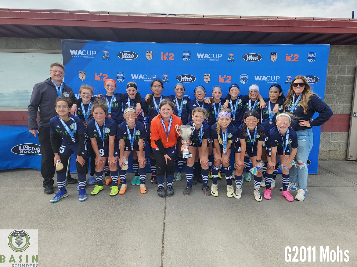 The G2011 Mohs Basin Sounders team won the 13U girls Bronze division at the WA Cup last weekend. Back row, left to right: Coach Rian Allred, Ilyssa Allred, Paislee Santisteban,  Calley Sly, Camila Quezada, Rafaela Arnberg, Maribel Arreola, Peyton Ross, Reese Char, Paisley Sly, Jasmine Monrroy, Coach Rachel Mohs
Front row, left to right: Brianna Arana, Mayan Orton, Ellie Molitor, Zoe Schmieder, Brooke Munro, Harlyn Magana, Marilyn Deras, Lyric Nishida (Not Pictured: Emera Loiseau).