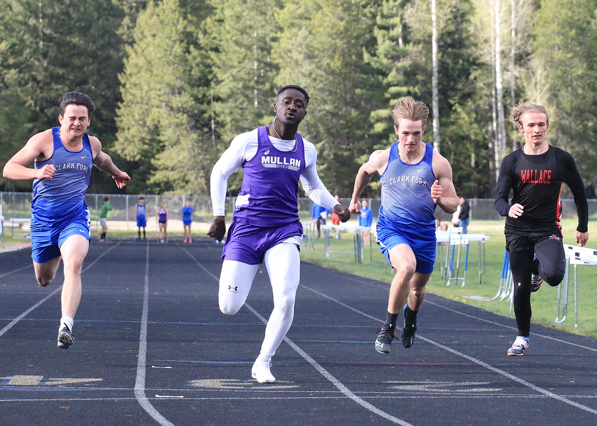 Mullan senior Kofi Appiah edges out Clark Fork's Dillon Ryan-Downing (left) and Wyatt Mintken (right) to win the 100-meter dash.