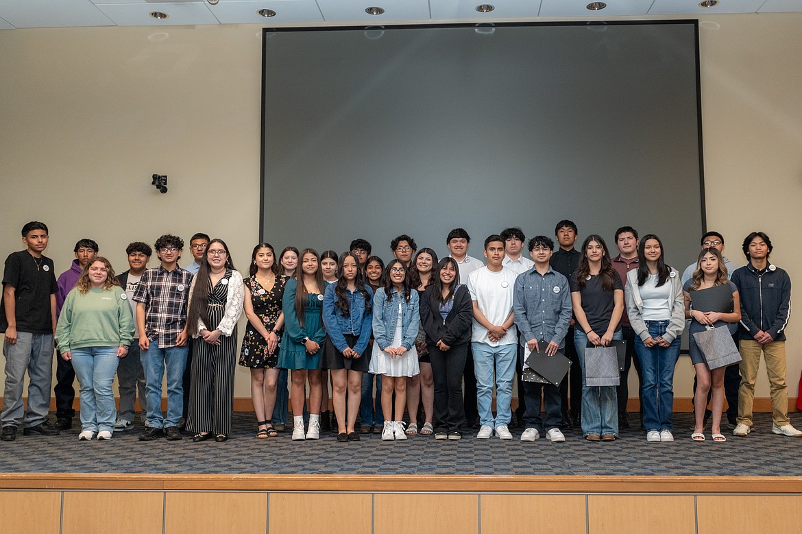 Newly-inducted TRiO Upward Bound students stop for a photo opp during Tuesday's induction ceremony.