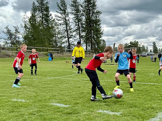 Photo by MELISSA SVENSON
On Saturday the Timbers North FC 2016 Boys Red Team beat the Spokane Sounders B2016 North Blue team 12-2 at the Spokane Polo Fields in Airway Heights. Red goals were scored by Mitchell Volland (4), Elijah Cline (4), Greyson Guy (2), Jaxson Matheney (1) and Isaak Sterling (1). Pictured in the red jerseys from left are Isaak Sterling, Jaxson Matheney, Greyson Guy and Kevin Sahm.