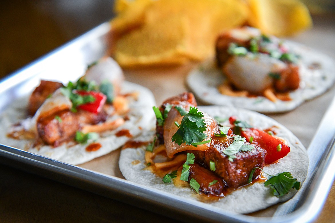 The Dragon Belly tacos featuring pork belly in a sweet and slightly spicy dragon sauce with onions, bell peppers and cilantro at Atomic Tacos in Kalispell on Tuesday, April 30. (Casey Kreider/Daily Inter Lake)