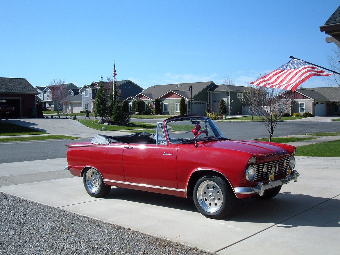 A red 1964 Hillman Super Minx convertible is one of the cars on display in the car show being put on by the Order of the Eastern Star.