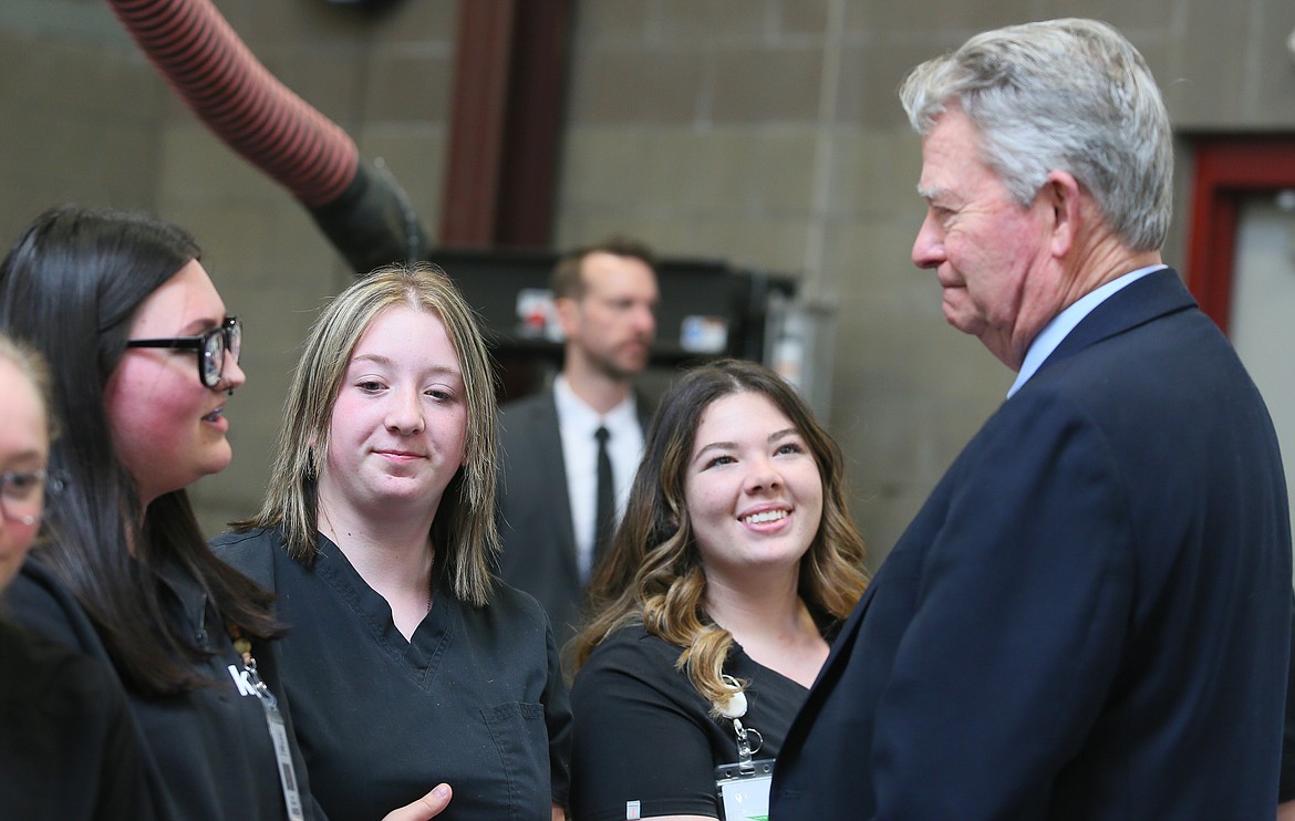 From left, KTEC certified nursing assistant students Kenzie Bennett, Emalie Hardaway and Rhianna Kent chat with Gov. Brad Little before a press conference Wednesday.