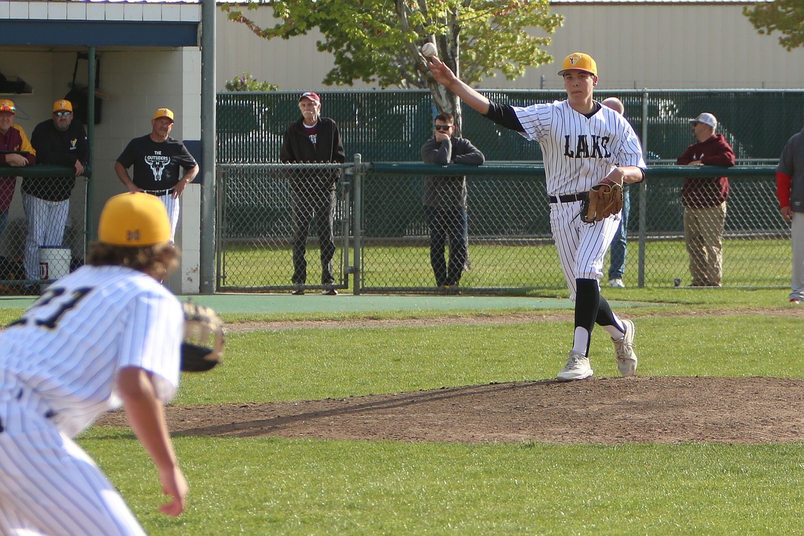 Moses Lake junior Kason Whitaker, right, throws a pick-off attempt to first baseman Jacoby Fulbright, left, during Tuesday’s game against West Valley (Yakima). Whitaker pitched five innings on Tuesday, surrendering four hits, one earned run and no walks while recording four strikeouts. Fulbright gave Moses Lake a 2-0 lead with a two-RBI single in the third inning.