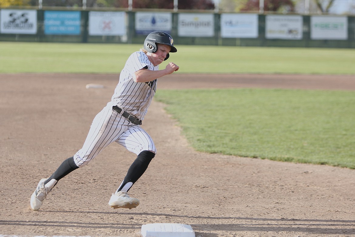 Moses Lake senior Willem Jansen rounds third base in the bottom of the sixth inning against West Valley (Yakima).