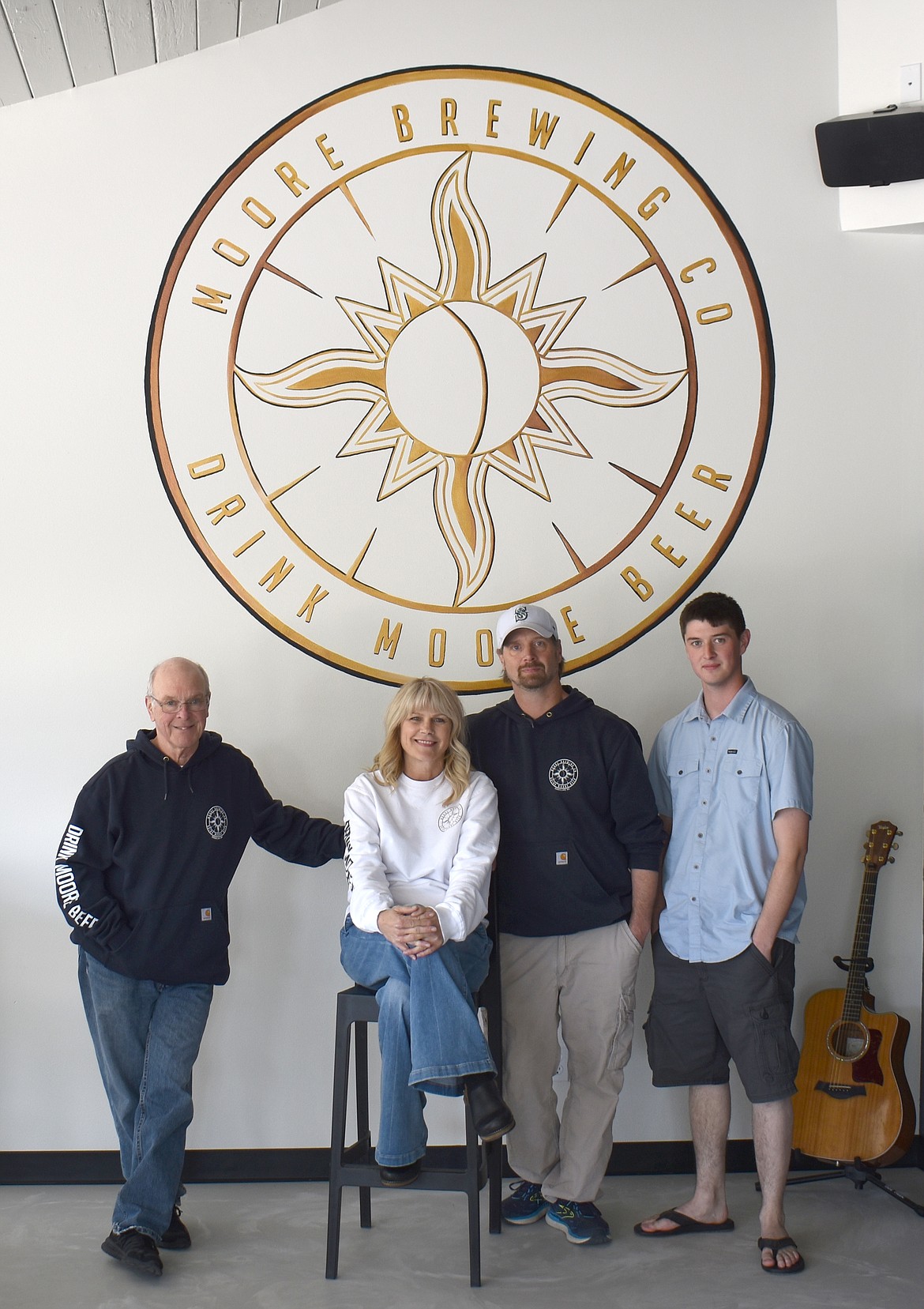 From left: Brad Moore, Lorie Moore, Chris Moore and Zach Moore. Brad runs the business side of Moore Brewing Company, Lorie handles marketing and sales, Chris manages operations and Zach makes the beer.